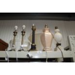 A collection of various table lamps and shades