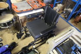 An Invacare lightweight folding wheelchair