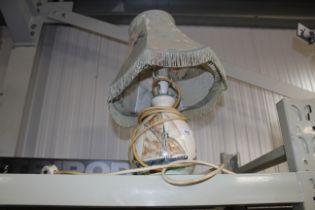 A pottery table lamp with ship decoration and shad