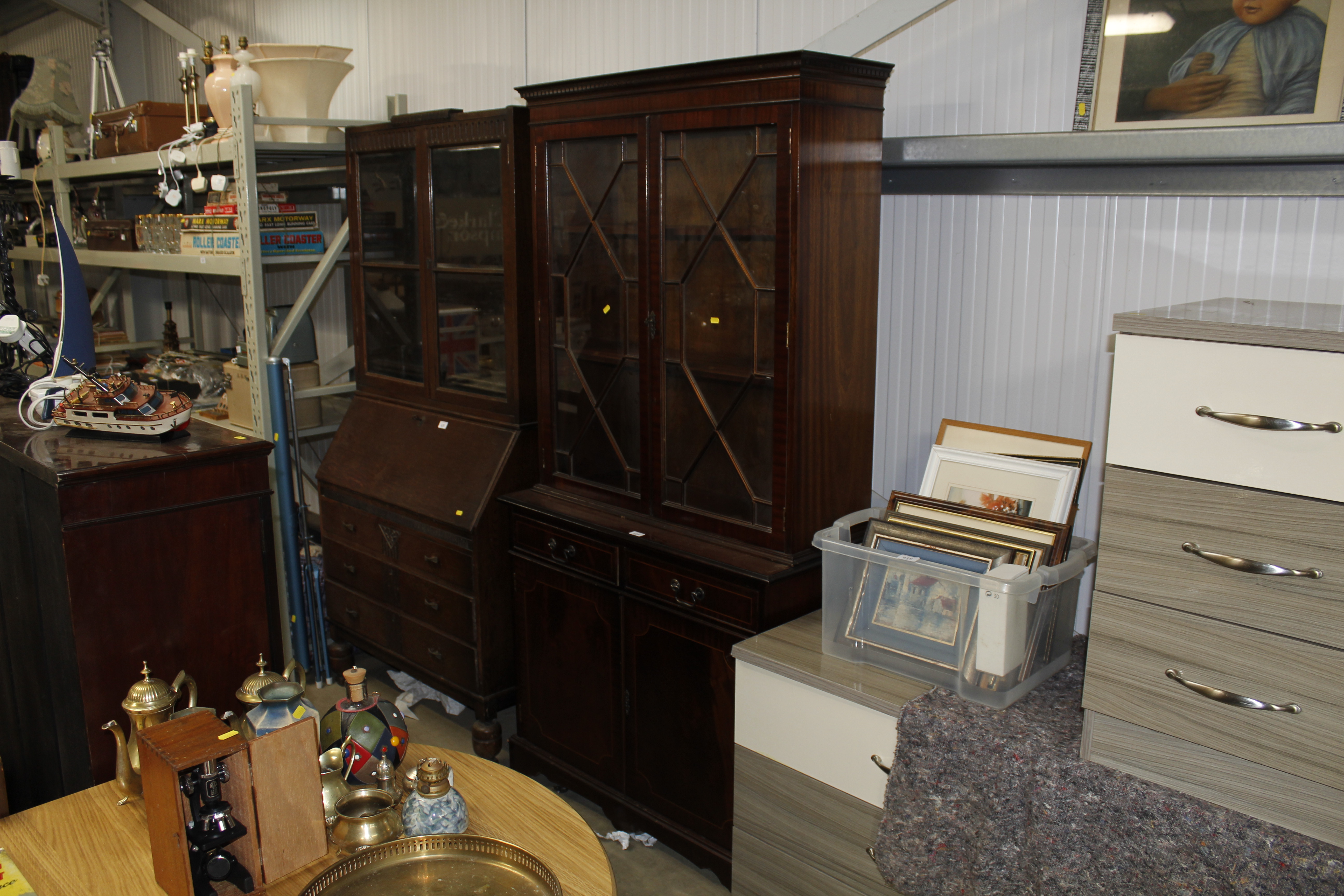 A reproduction mahogany bookcase on cupboard base