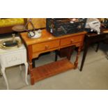 A modern hall table fitted two drawers