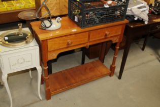 A modern hall table fitted two drawers