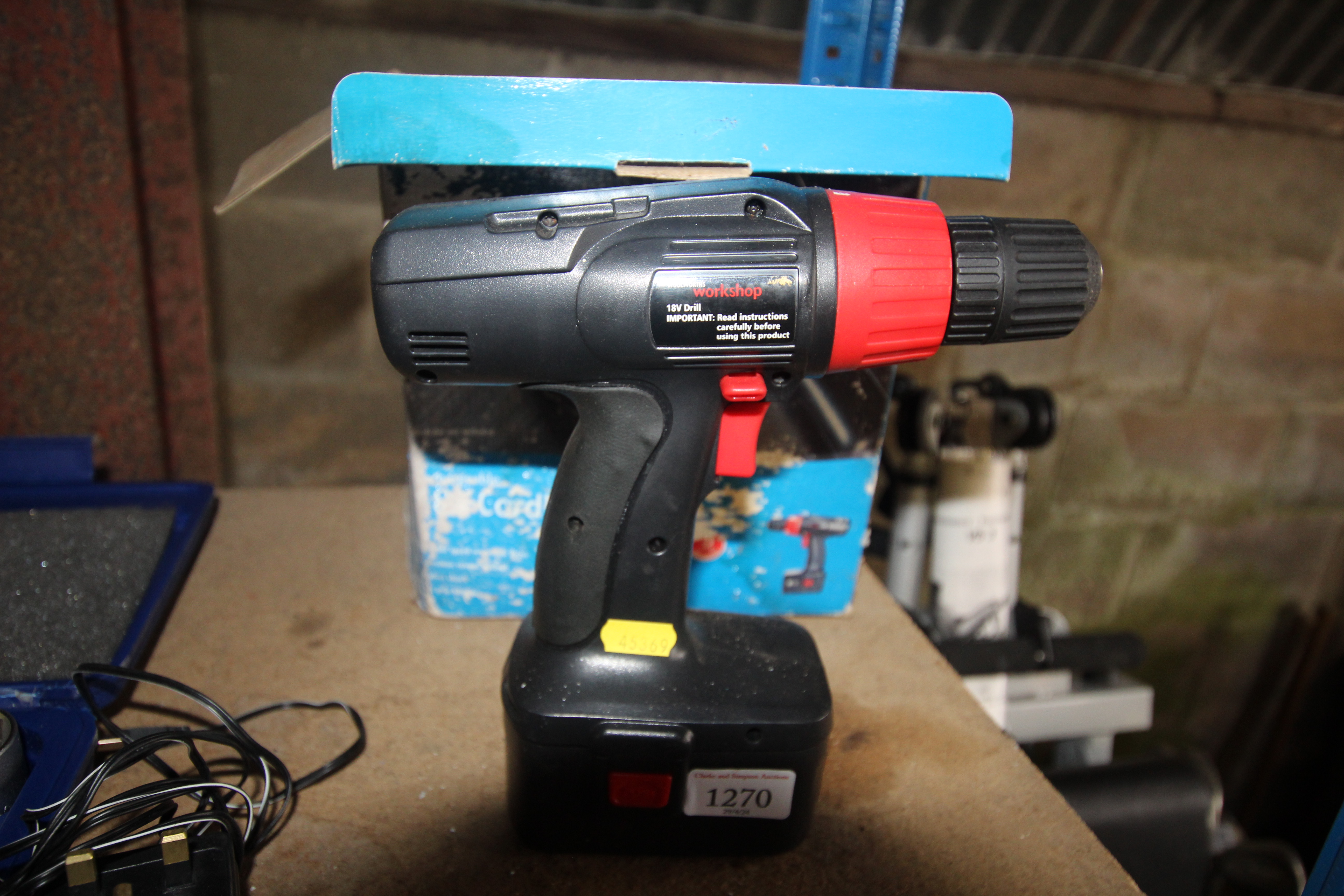 A Woolworths workshop 18v drill with battery, char