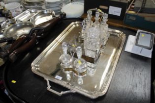 A silver plate and glass cruet, some with silver t