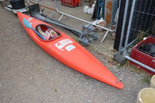 An Ace kayak with paddle etc.