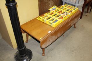 An oak drop leaf coffee table