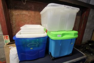 A quantity of plastic storage boxes