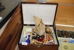 A trinket box and contents of various costume jewellery