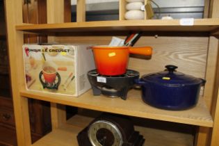 A Le Creuset fondue set and a Chasseur casserole d