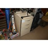 A wood effect three drawer chest