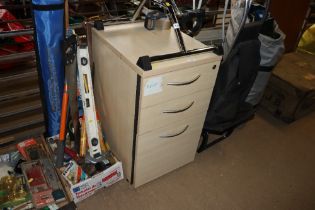 A wood effect three drawer chest