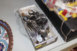 A box of various souvenir and other tea spoons