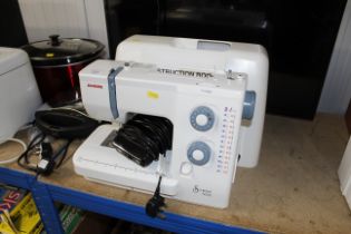 A Janome 525S sewing machine with carrying case an