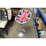 An industrial style adjustable bar stool upholster
