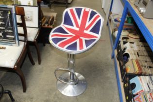 An industrial style adjustable bar stool upholster