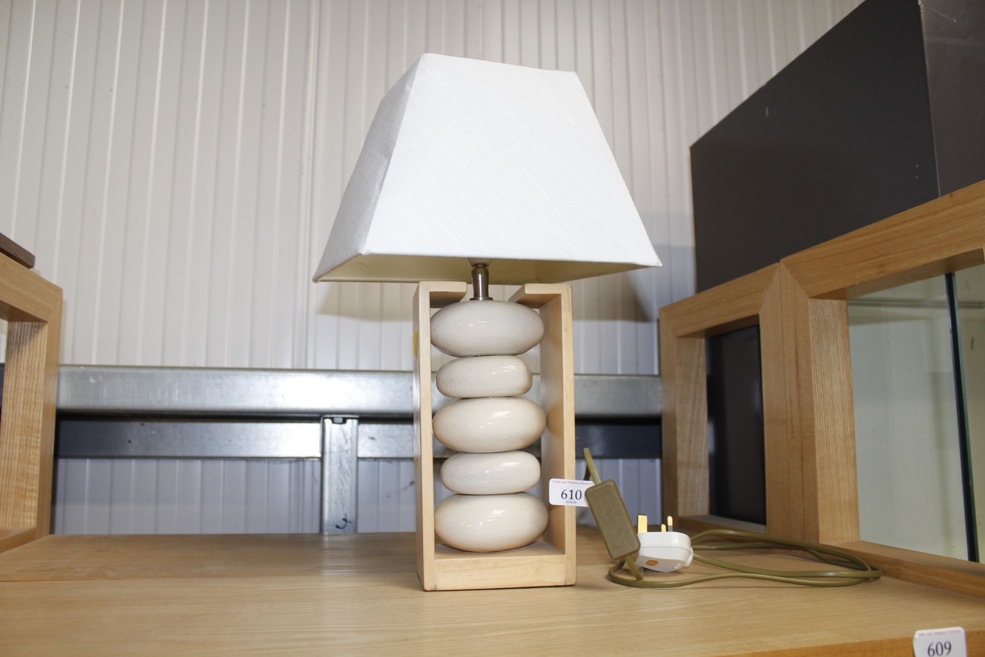 A modern design wooden and pottery table lamp with