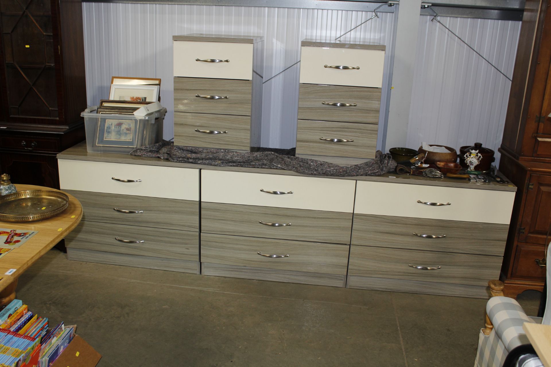A laminate nine drawer bedroom unit and a pair of