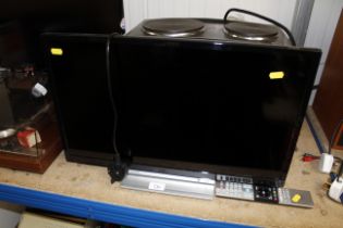 A Toshiba flat screen television and remote contro