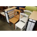 A pair of pine chairs together with two white slat