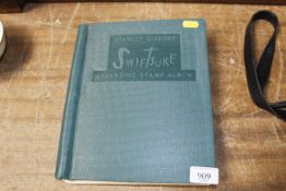 A Swift Shaw stamp album and contents