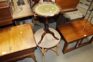 A mahogany wine table on tripod base together with