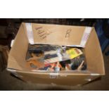 A box containing a large quantity of paint brushes