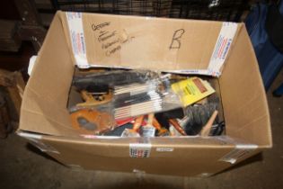 A box containing a large quantity of paint brushes