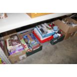 Four boxes containing various soft toys, books, bo