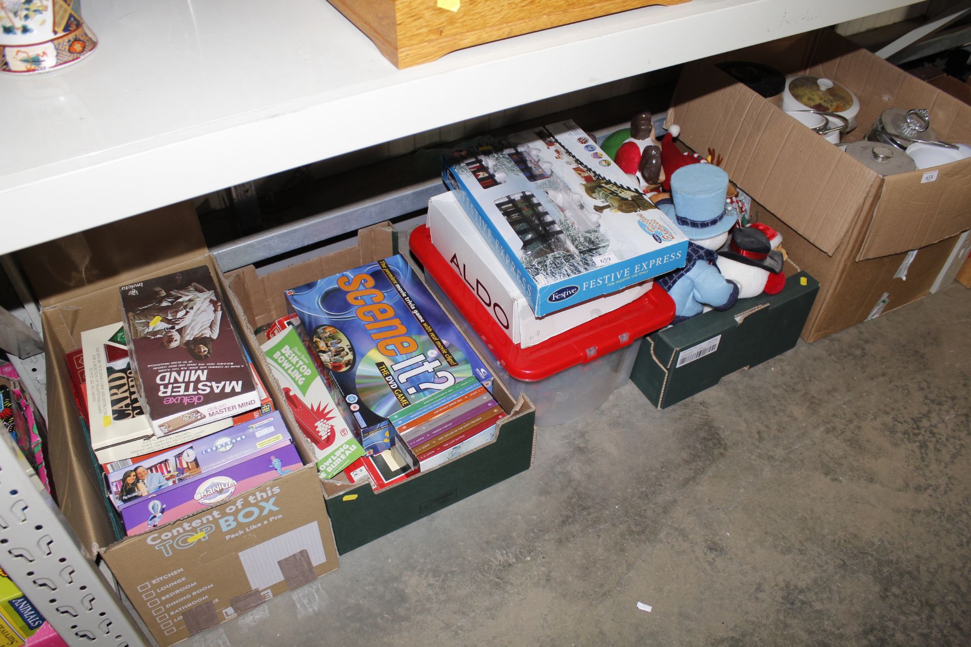 Four boxes containing various soft toys, books, bo