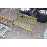 A child's two seater wooden slated garden bench wi