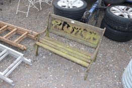 A child's two seater wooden slated garden bench wi