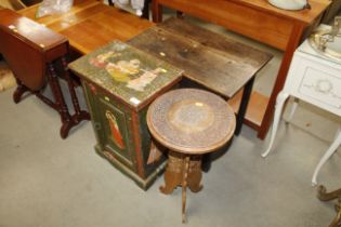 An Eastern carved wooden occasional table together