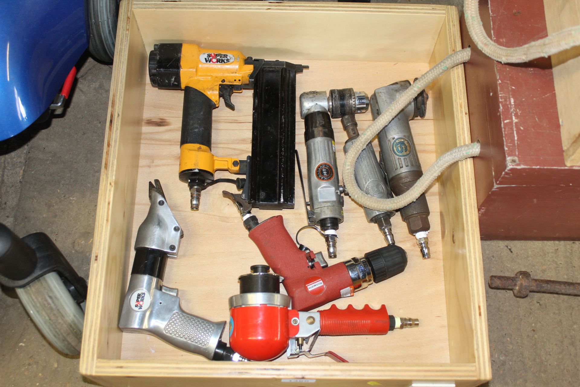 A wooden tray and contents of various air powered
