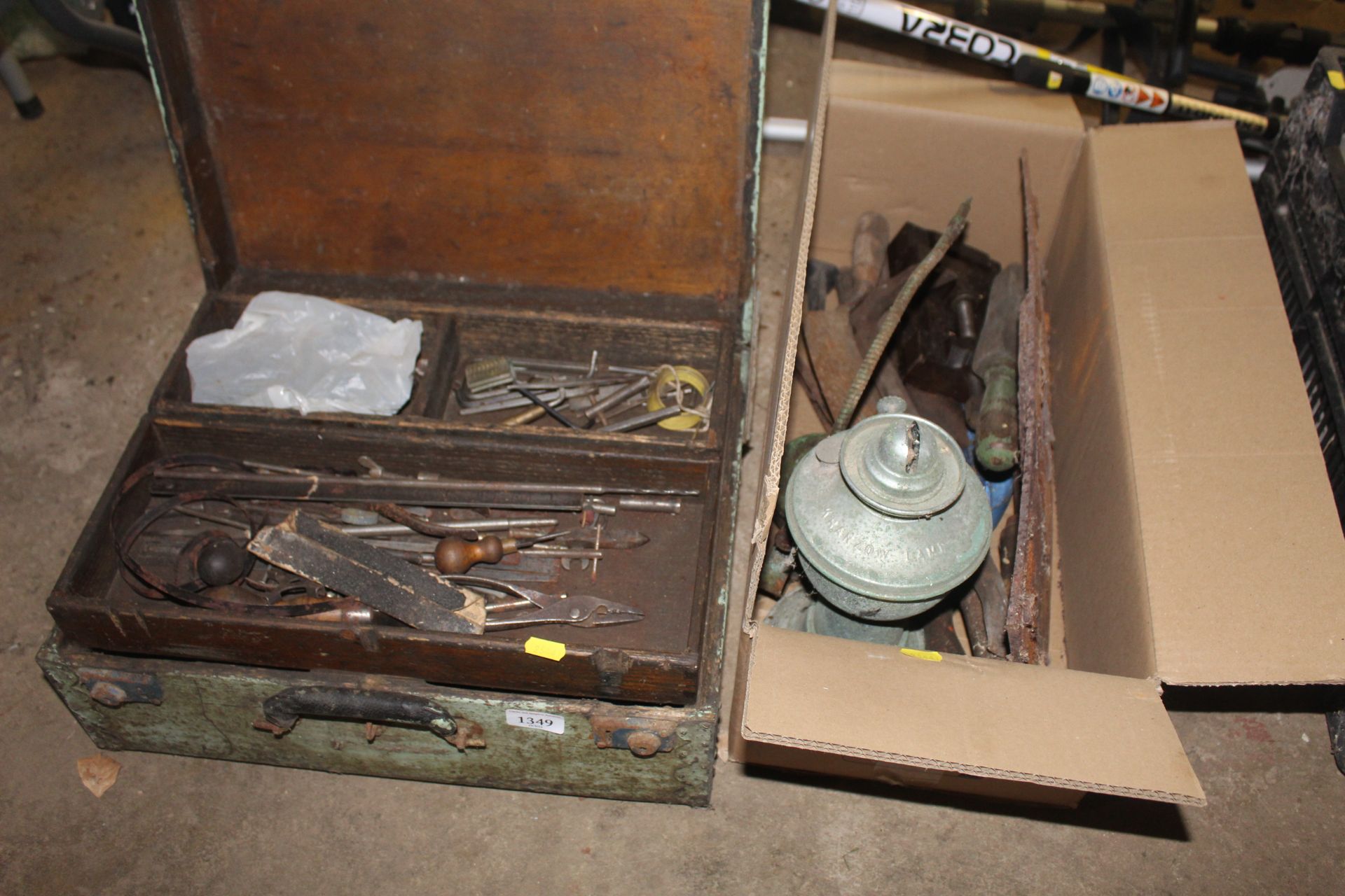 A wooden tool box with interior tray and contents