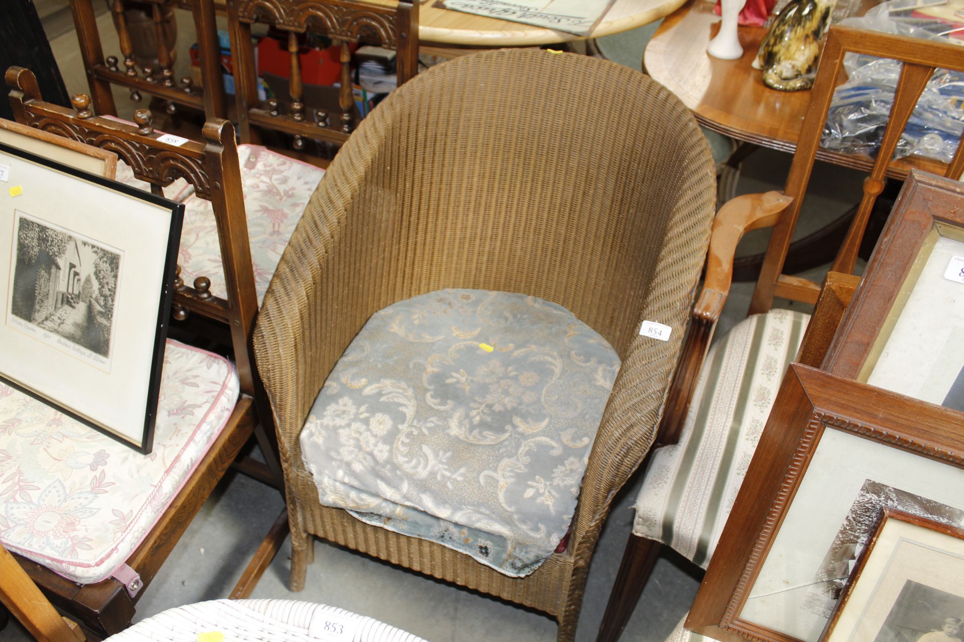 A Lloyd Loom style wicker armchair