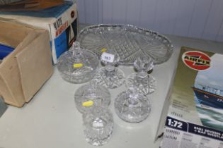 A collection of glass dressing table items