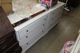 A pair of white bedroom chests fitted three drawers