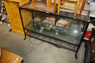 A black metal frame display cabinet