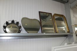 Two gilt framed wall mirrors, wrought iron framed