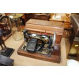 A Singer sewing machine in fitted wooden case