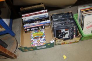 Two boxes containing Marvel graphic novels and ann