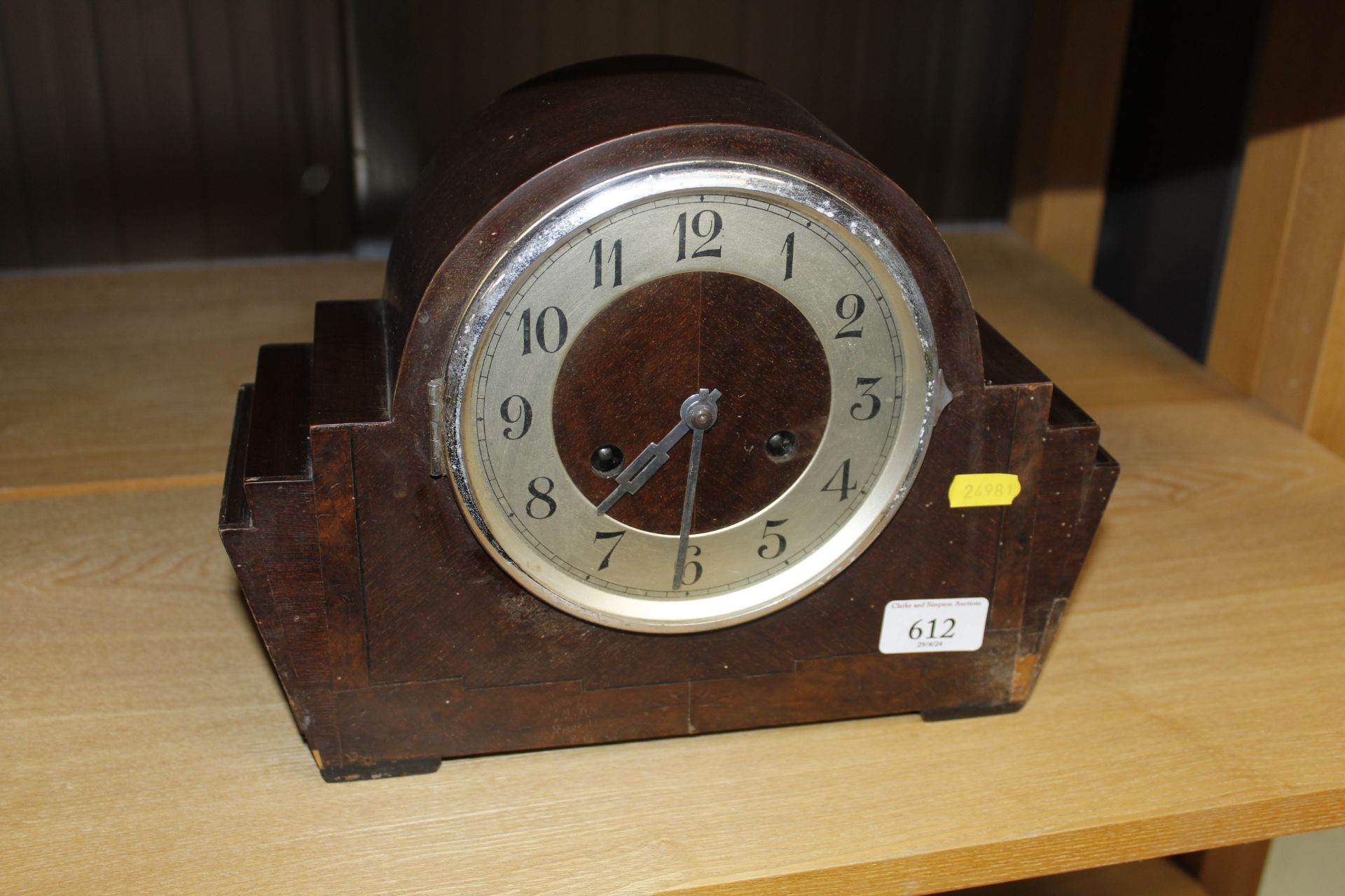 An Art Deco walnut cased mantel clock