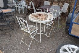 A white painted metal bistro set