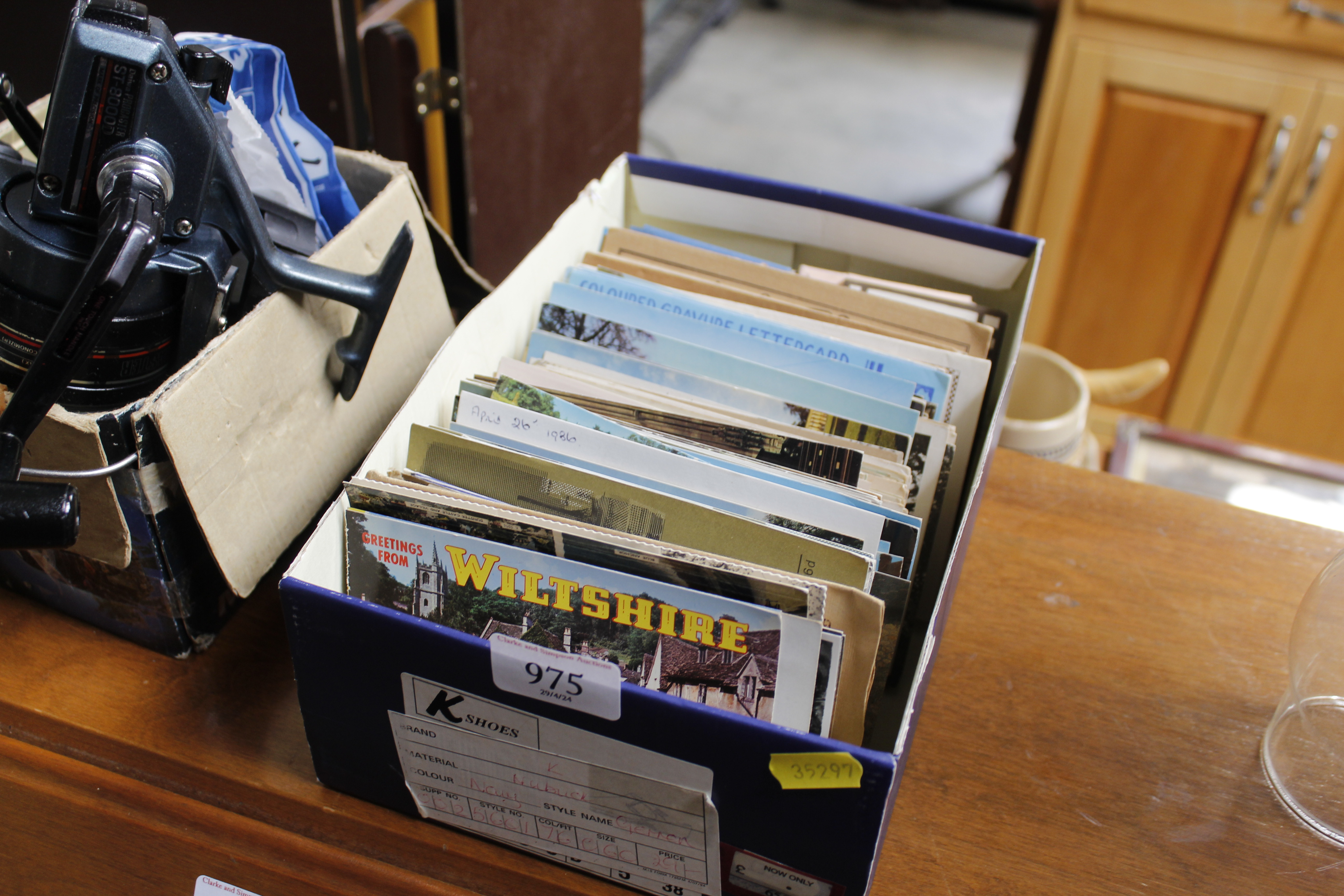 A box containing various postcards