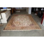 An approx. 11'7" x 8'1" green patterned rug AF