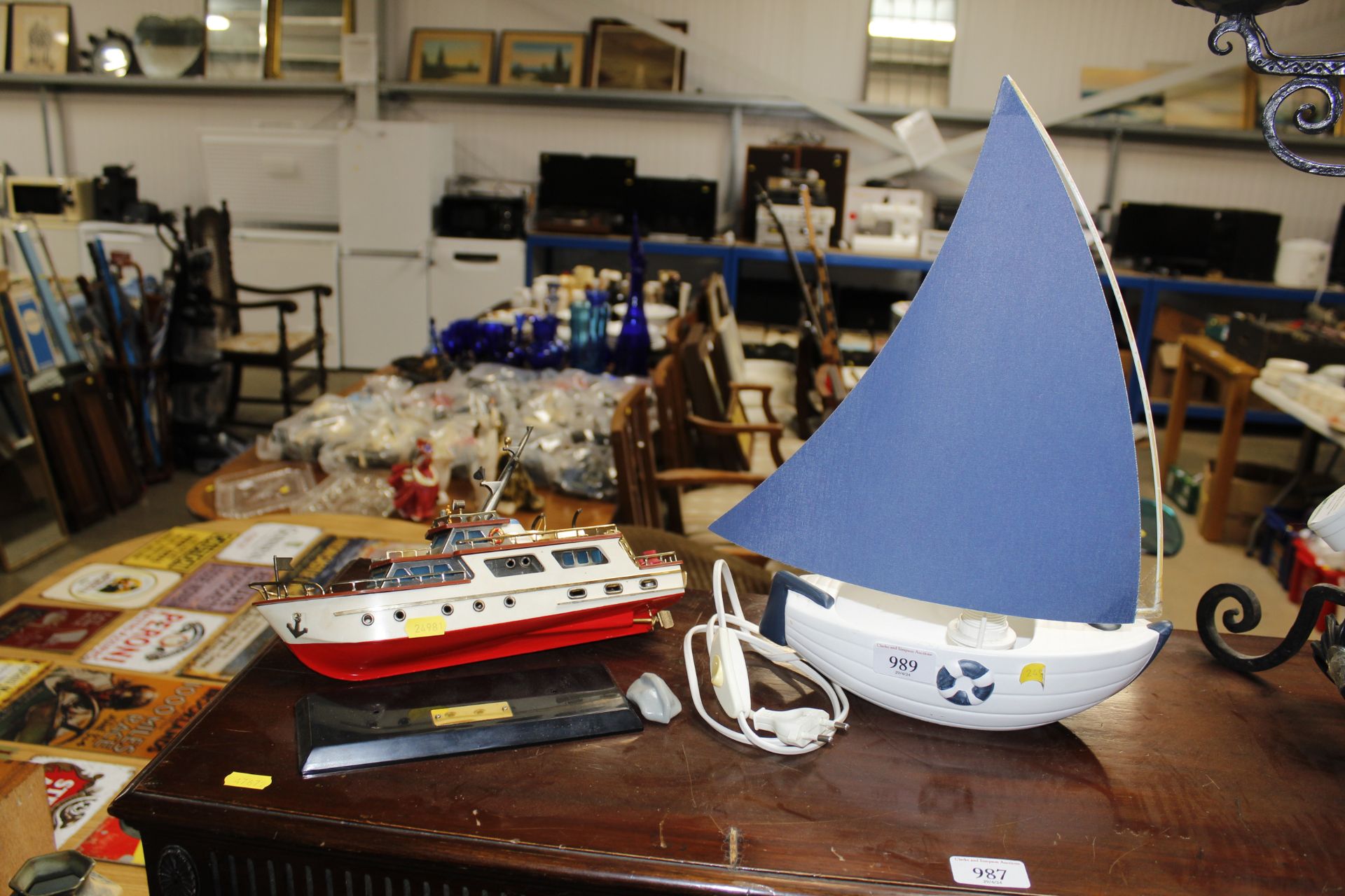 A table lamp in the form of a boat and a model boa