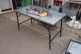A metal topped folding table