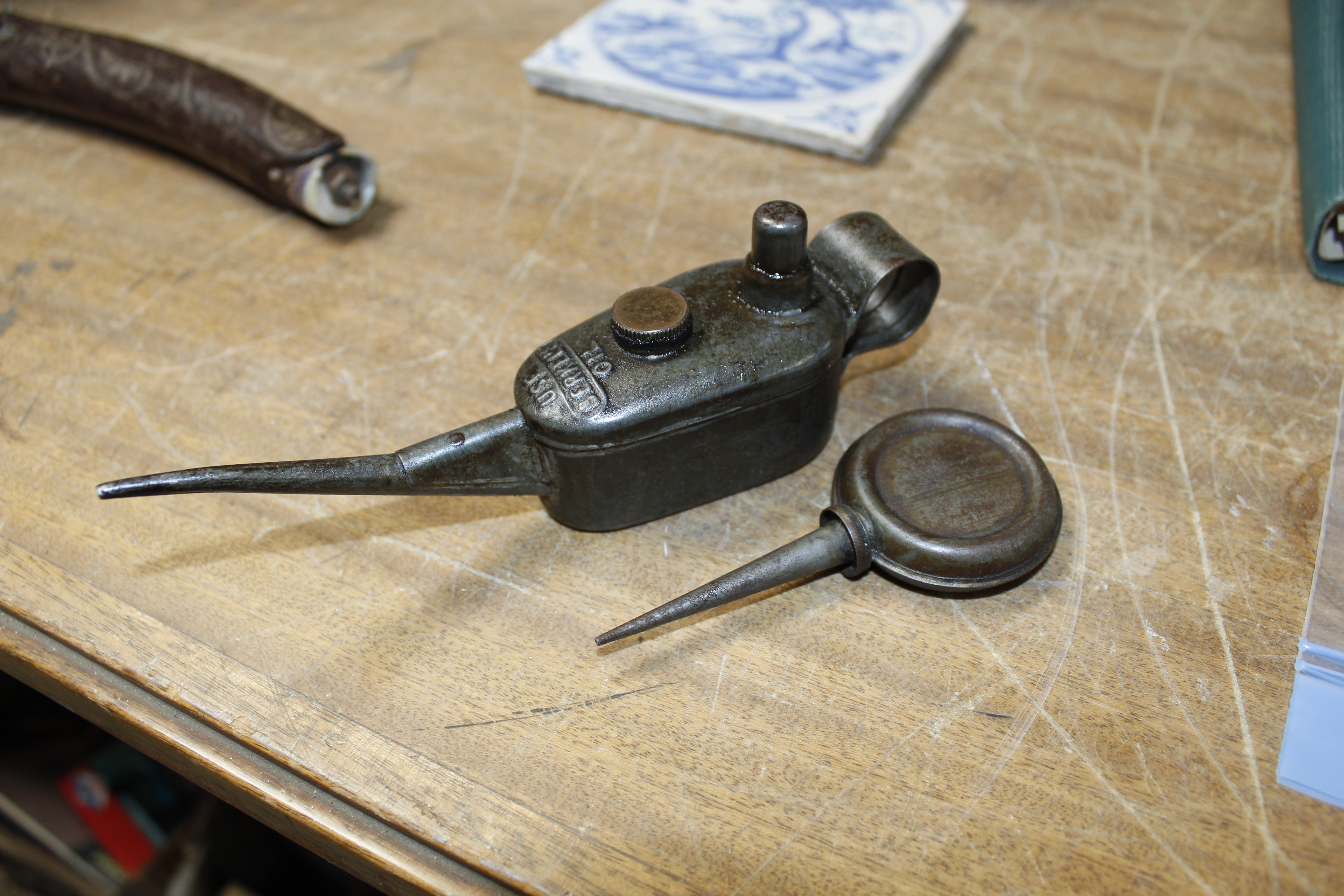 A Berkel's oil can and another