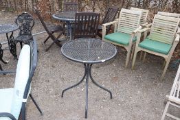 A small metal circular garden table