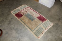 An approx. 5' x 2'6" modern patterned rug